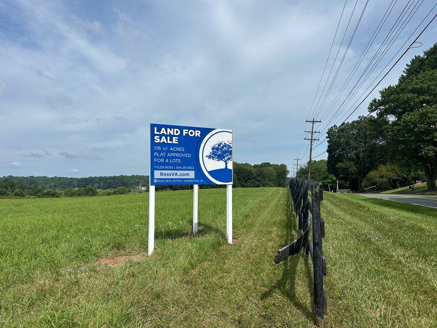 Tyler with a land-for-sale sign in Fauquier County, Virginia